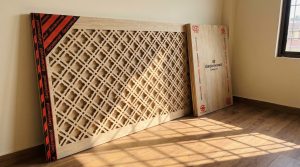 CNC carved plywood panel showing Newari window design plywood lattice pattern